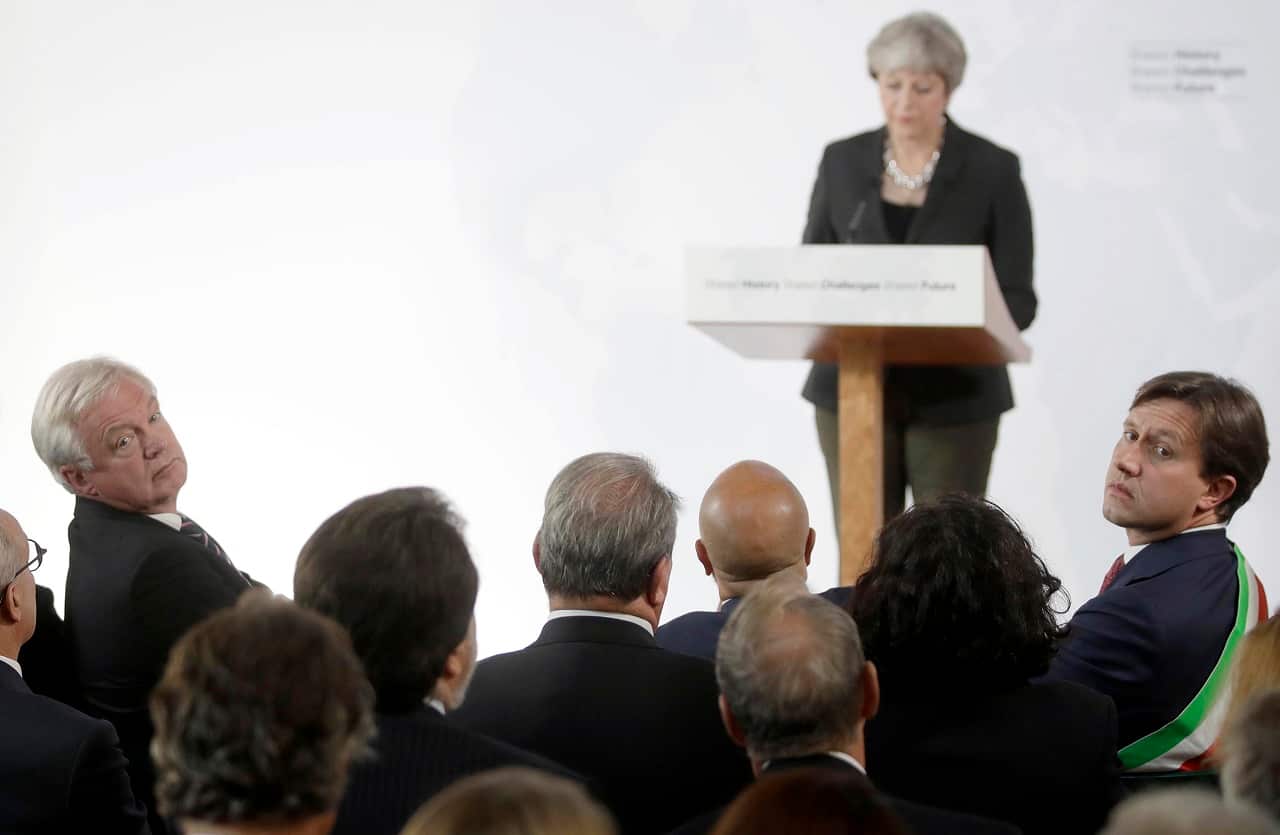 Brexit secretary David Davis (left) listens as British Prime Minister Theresa May delivers a speech in 2017.