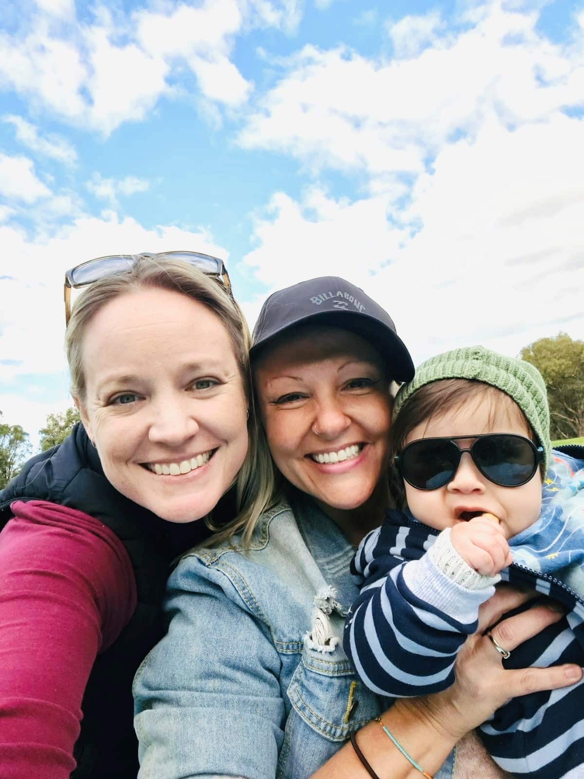 Raquel Schwarcz-Young (centre), her wife Darcie and their son
