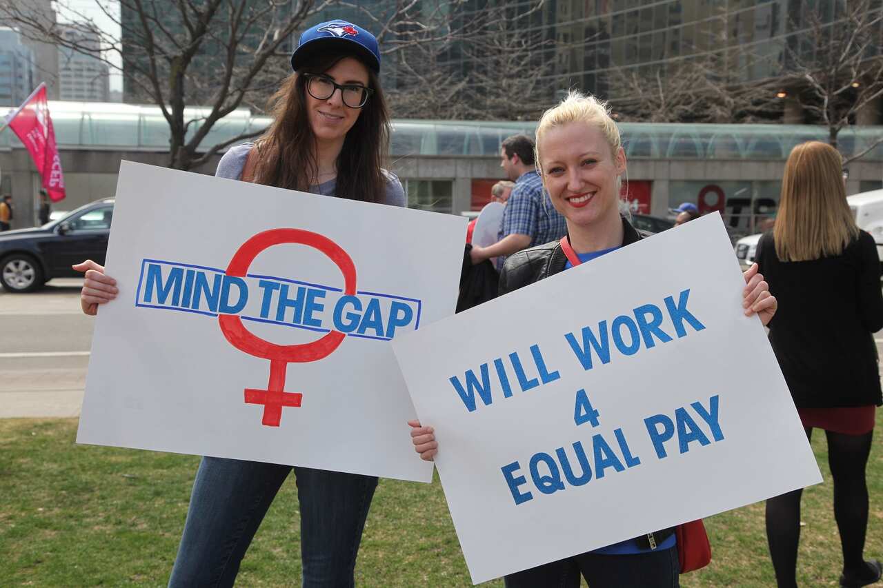 Women rally to demand equal pay for women in Toronto, Canada.
