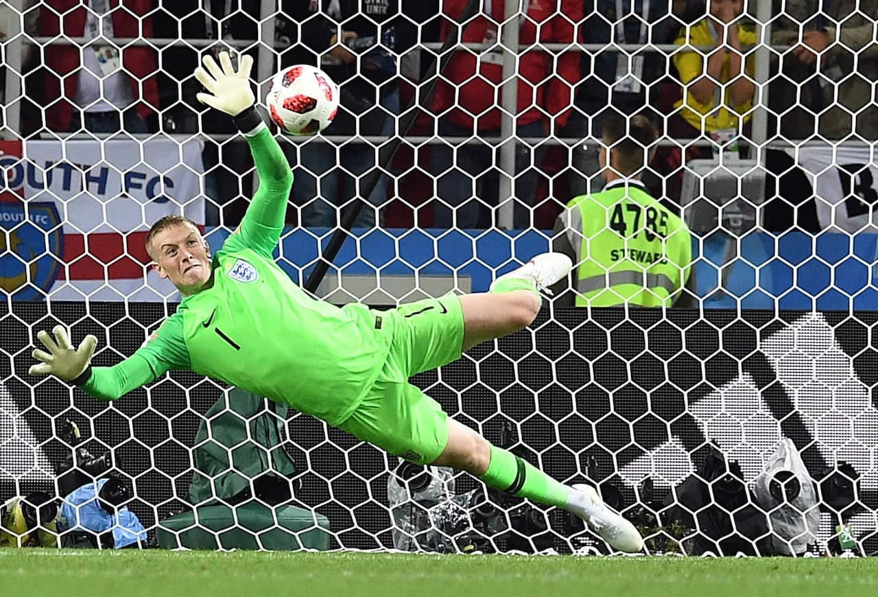 England goalkeeper Jordan Pickford stops a penalty shot from Colombia's Carlos Bacca 