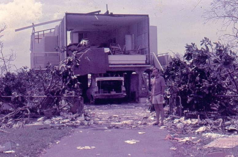 Geoff Thompson standing in front of his home after Cyclone Tracy in 1974