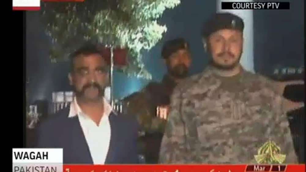 In this image made from video provided by PTV,  Wing Commander Abhinandan Varthaman walks to cross the border into India, in Wagah, Pakistan.