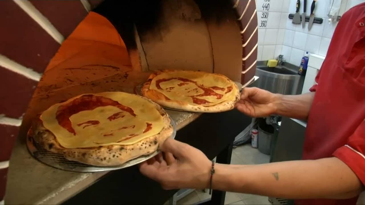 Pizzas about to enter the oven 