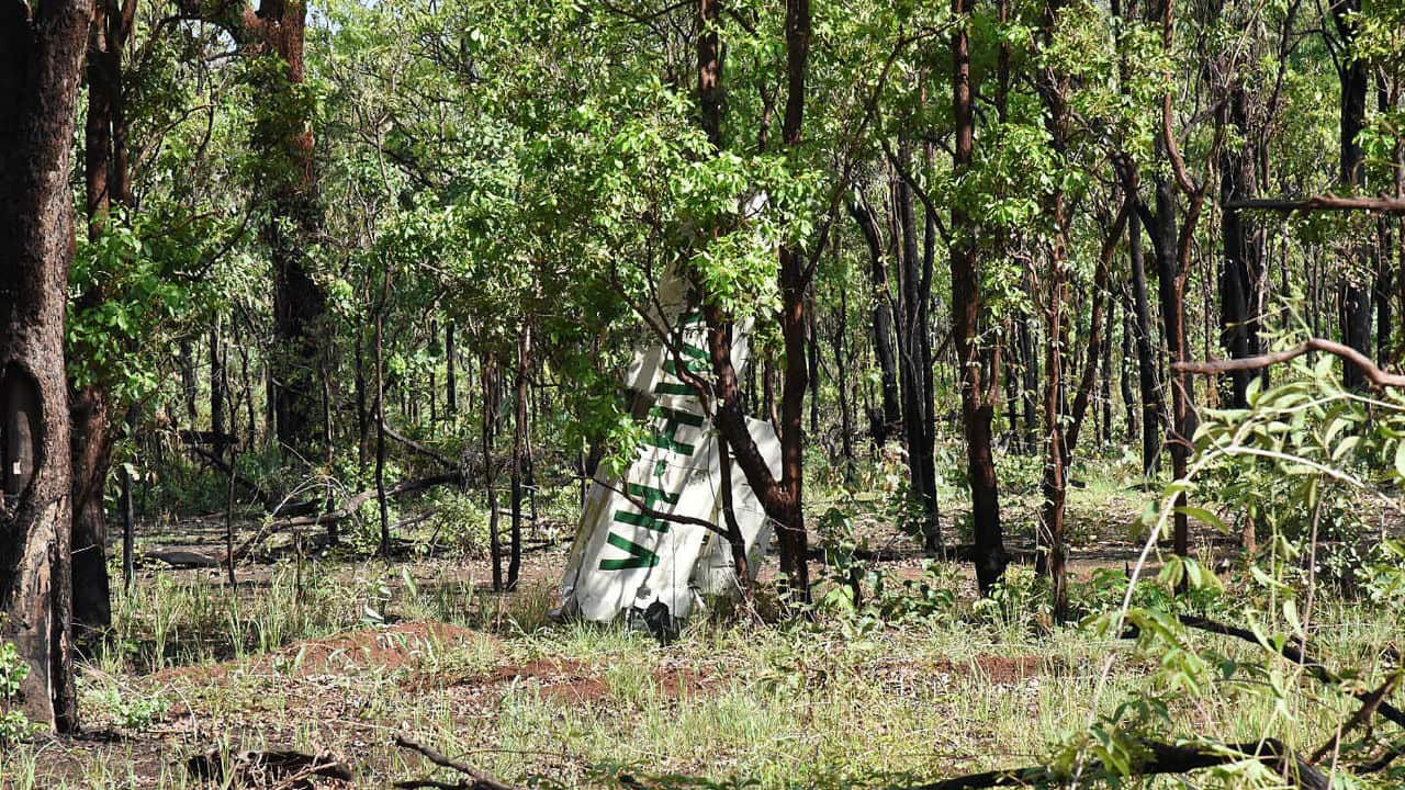 Wreckage from the light plane crash is seen on a remote Northern Territory road.