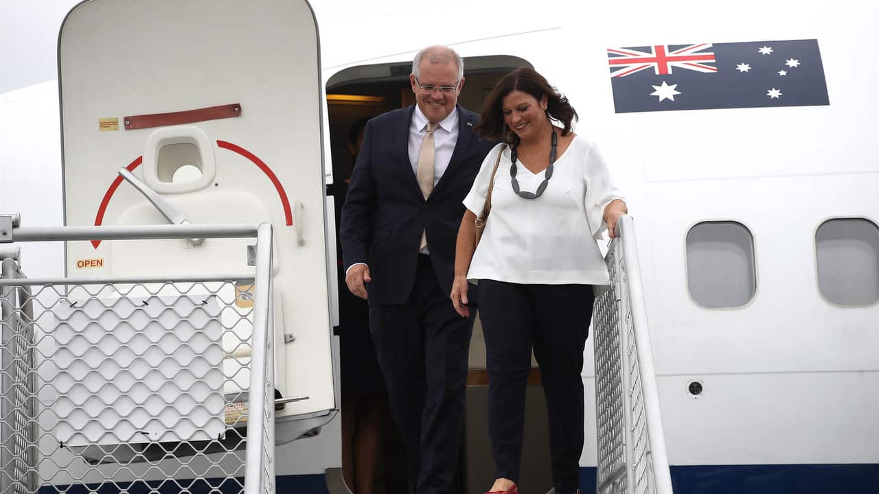 Australian Prime Minister Scott Morrison and his wife Jenny Morrison arrive at Auckland International Airport on Friday.