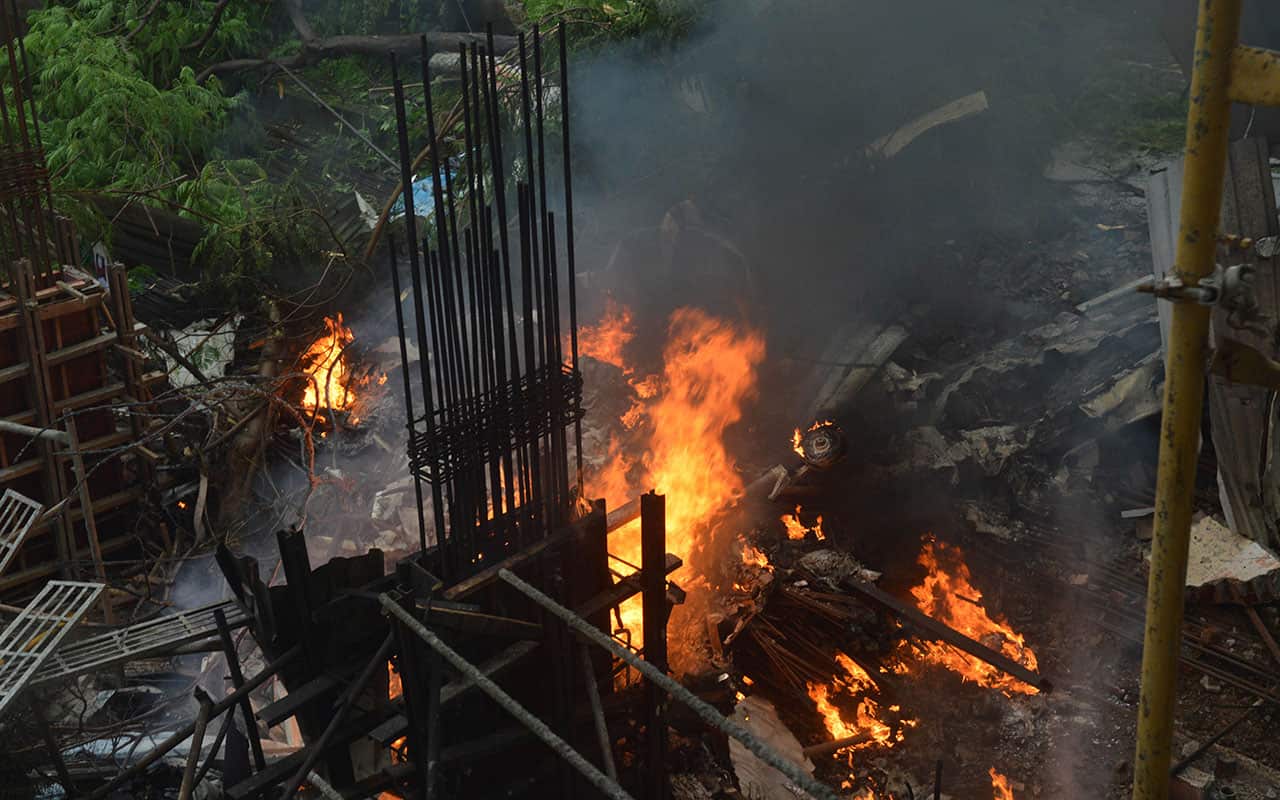 A private chartered plane goes up in flames after it crashed in Ghatkopar area, Mumbai, India, Thursday, June 28, 2018.
