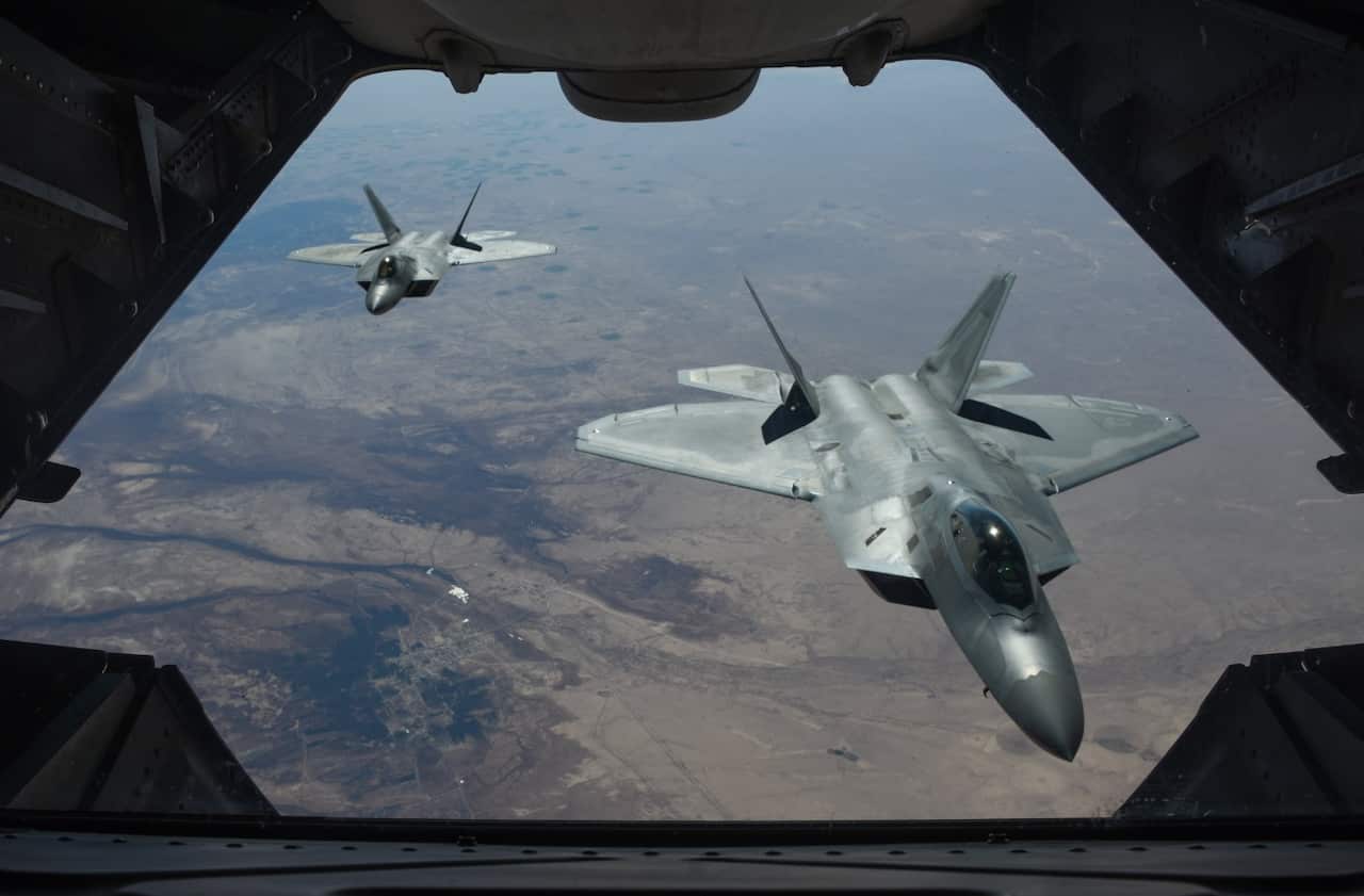 A handout photo made available by the US Department of Defense shows two US Air Force F-22 Raptors flying above Syria in support of Operation Inherent Resolve, 
