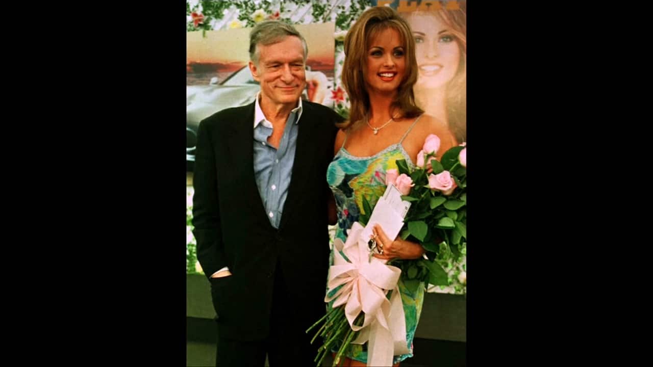 File image of Playboy playmate Karen McDougal with magazine founder Hugh Hefner.