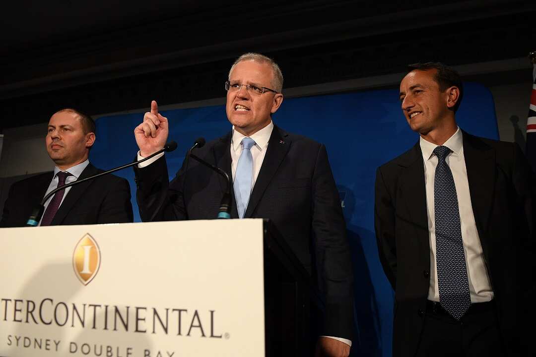 Australian Prime Minister Scott Morrison along with treasurer Josh Frydenberg and Liberal candidate Dave Sharma.