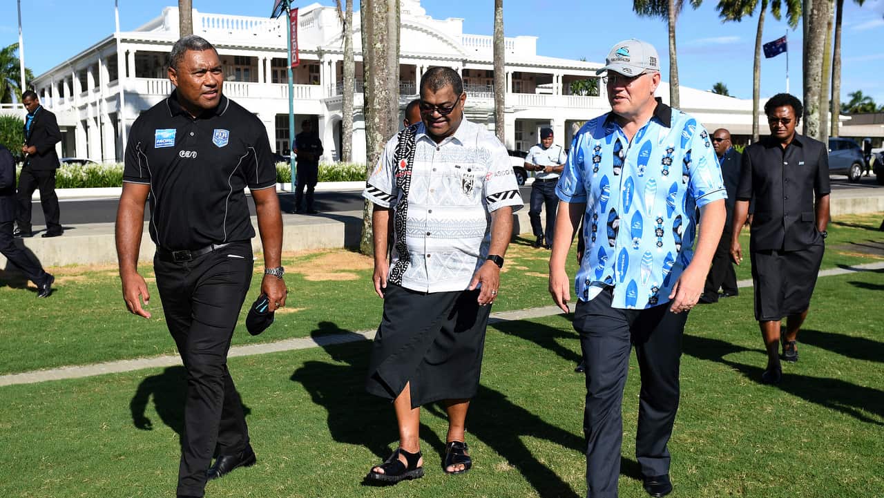 Scott Morrison with former rugby league player Petero Civoniceva and Executive Chair of Fiji National Rugby League Peni Musunanasi in Suva.