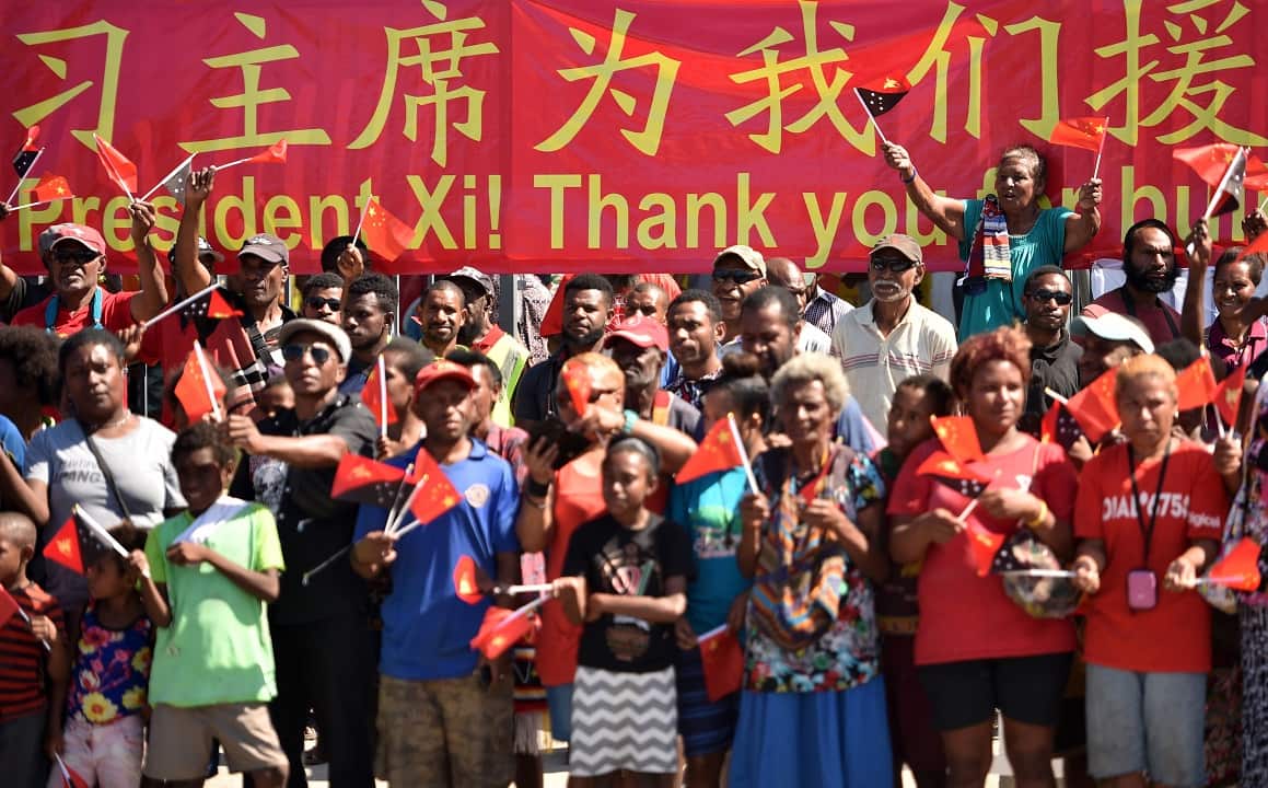 Crowds welcome the Chinese President Xi Jinping to the Butuka Academy school.