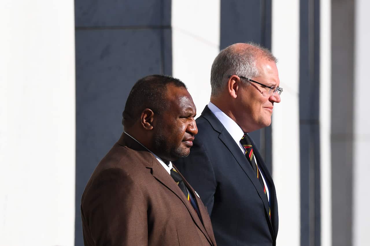 Prime Minister of Papua New Guinea James Marape and Australian Prime Minister Scott Morrison inspect the guard of honour during the official welcome ceremony.