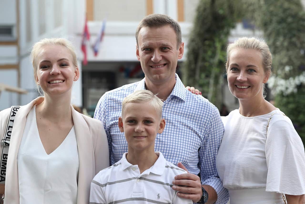 A file photo of Alexei Navalny, with his wife Yulia, daughter Daria, and son Zakhar