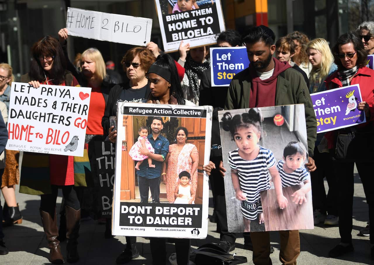 Supporters of the family gather outside the Federal Court in Melbourne.