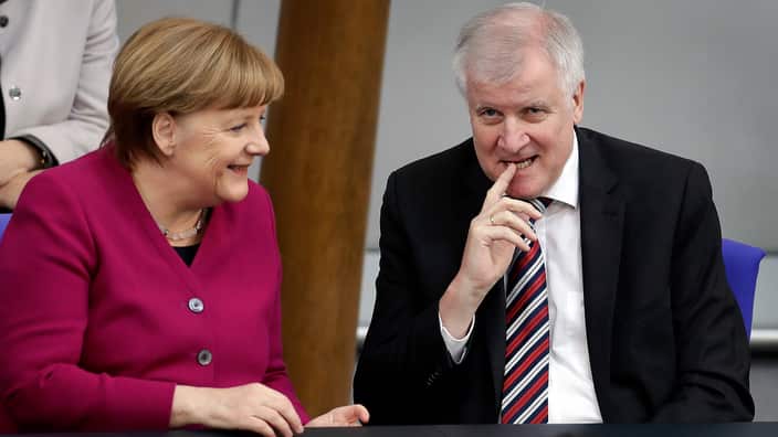 German Chancellor Angela Merkel (L) and Interior Minister Horst Seehofer at the Bundestag, in Berlin