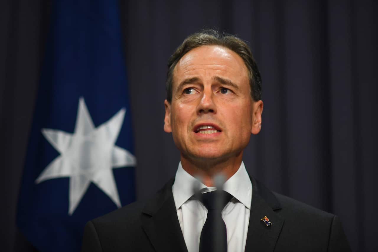 Health Minister Greg Hunt talks to the media.