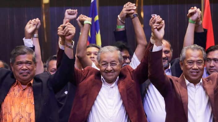 Mahathir Mohamad and his party celebrating