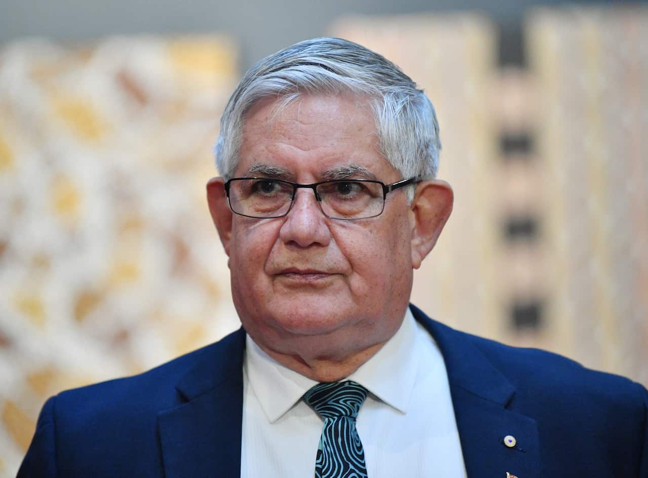 Man in glasses, a suit and tie.