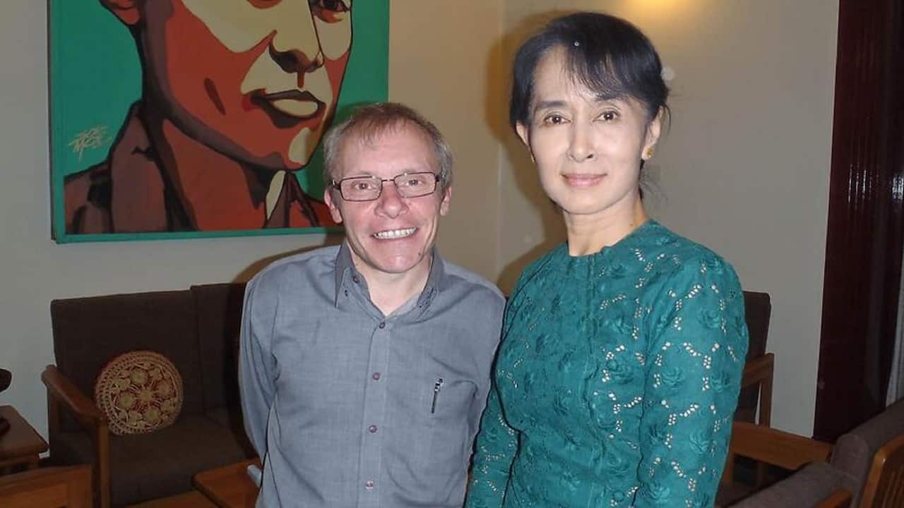 Sean Turnell standing next to Aung San Suu Kyi.