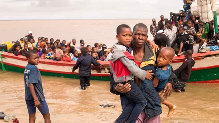 Survivors of Cyclone Idai arrive by rescue boat in Beira, Mozambique