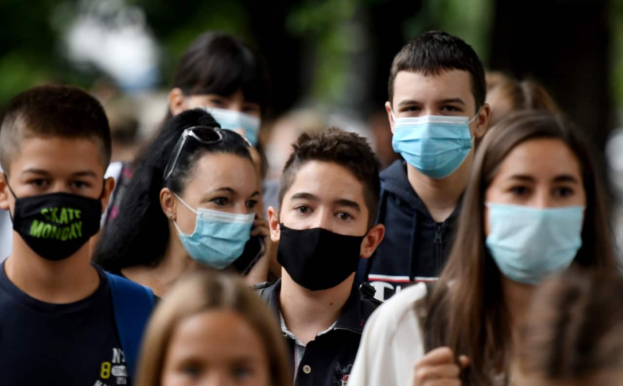Young people wearing masks