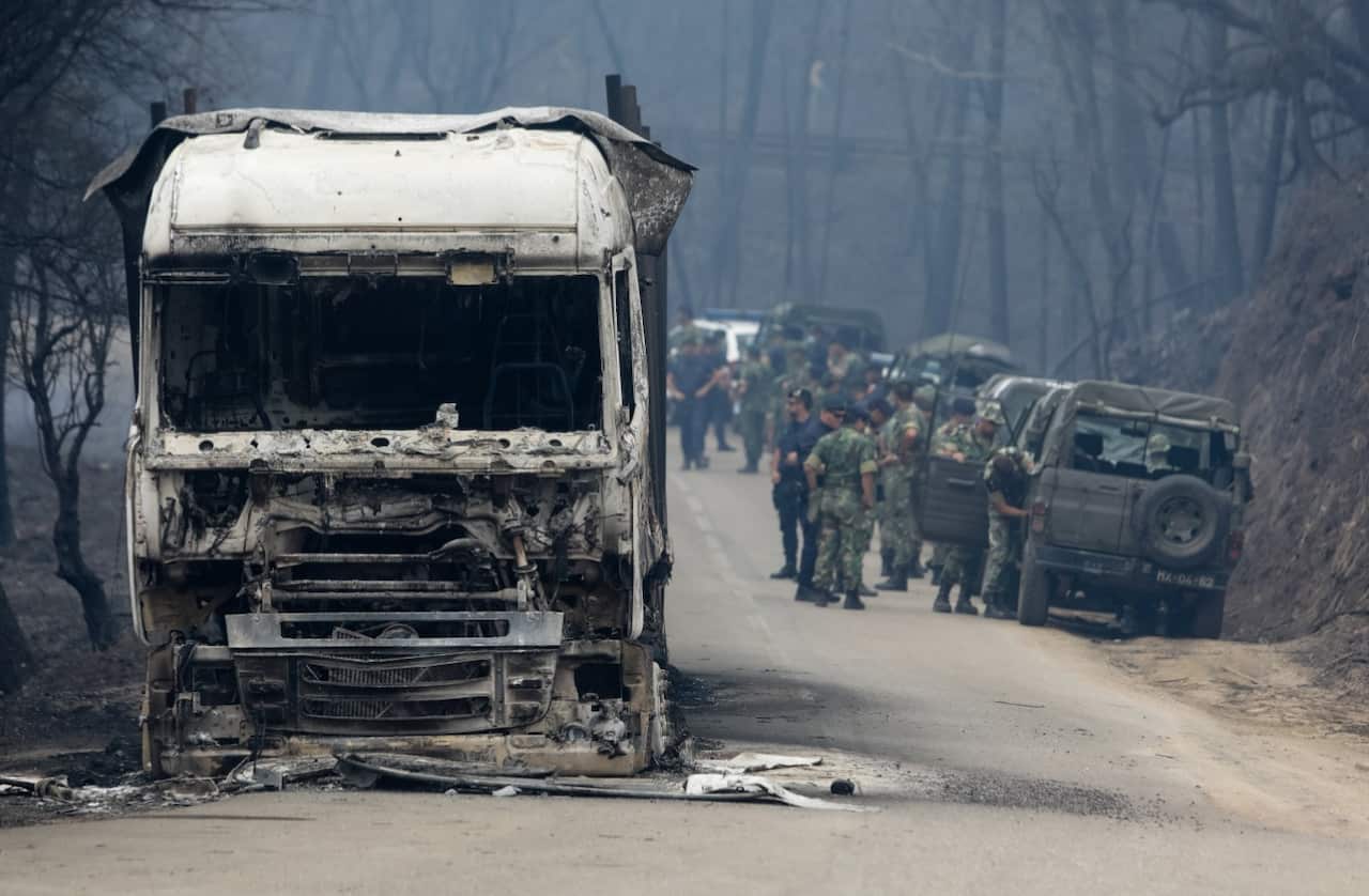Military personnel arrive at the village of Vila Facaia to help recovery efforts in the aftermath of the 17 June forest fires