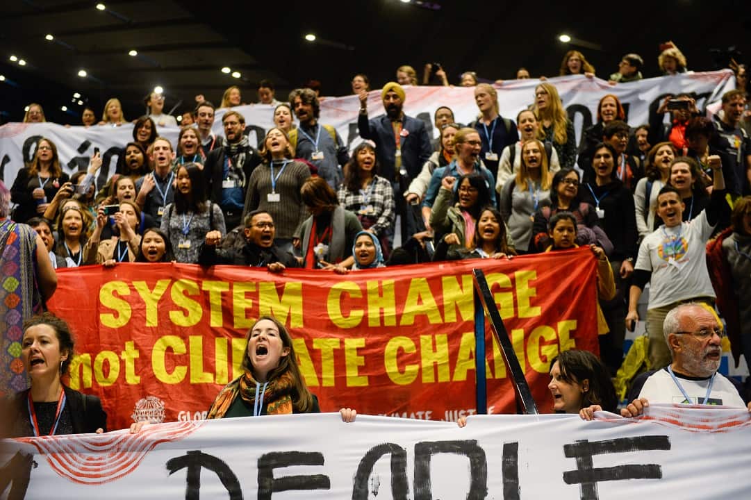 Activists stage a protest during the COP24 UN Climate Change Conference 2018.  