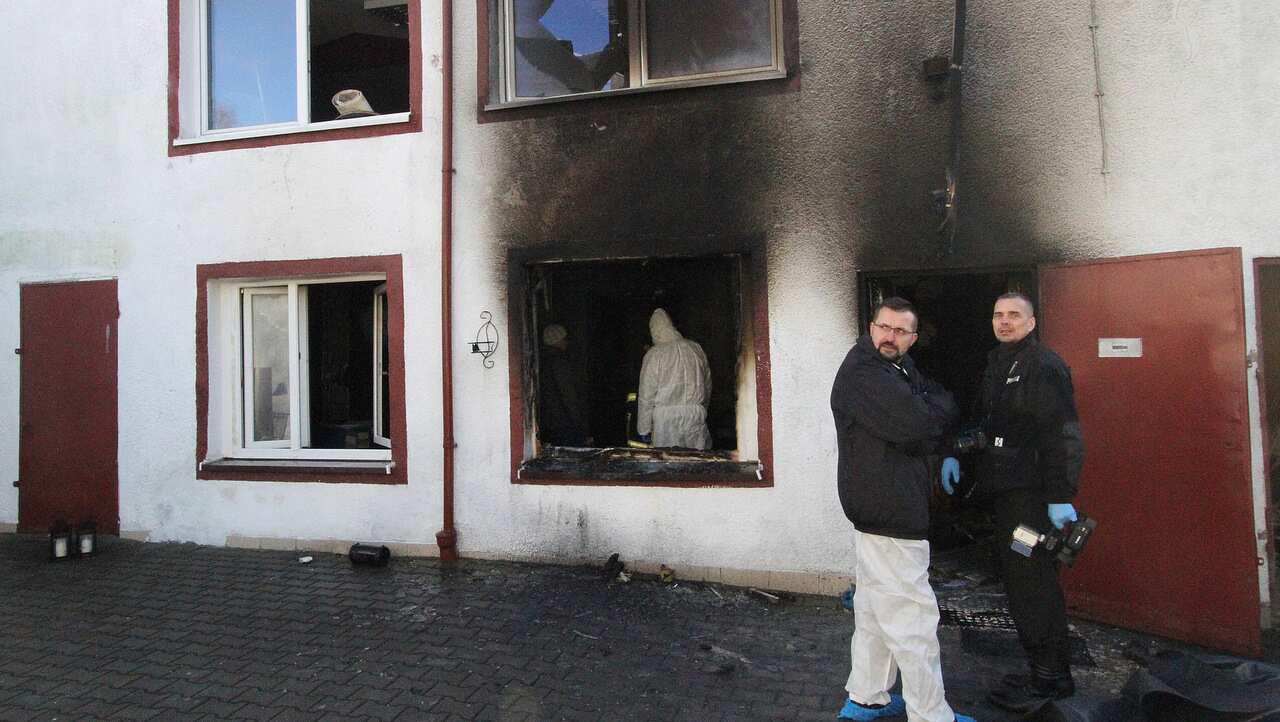 Forensic and other police experts examine the site of a fire in an Escape Room, in Koszalin, northern Poland.