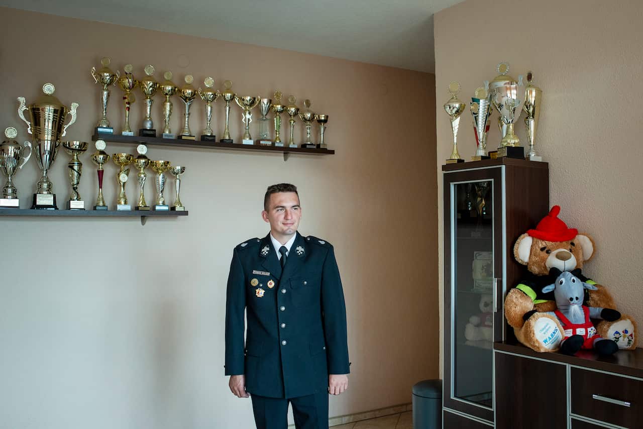 Tomasz Golasz, a professional firefighter who founded a youth fire brigade at the request of a group of girls in the village of Miejsce Odrzanskie, Poland, Aug. 1, 2019. (Kasia Strek/The New York Times)