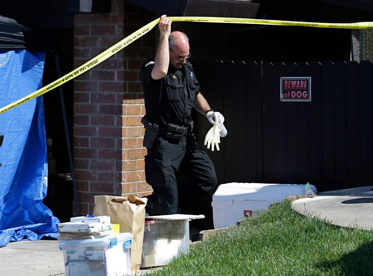 A Sacramento County Sheriff's deputy leaves the home of suspect Joseph James DeAngelo.
