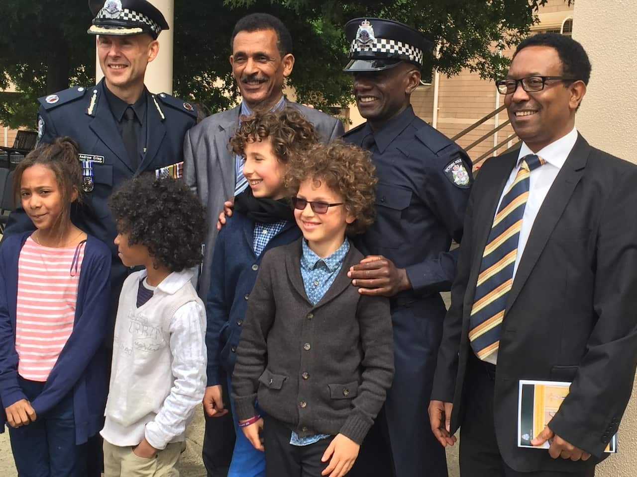 Sisay Dinku (far right) with Victoria Police