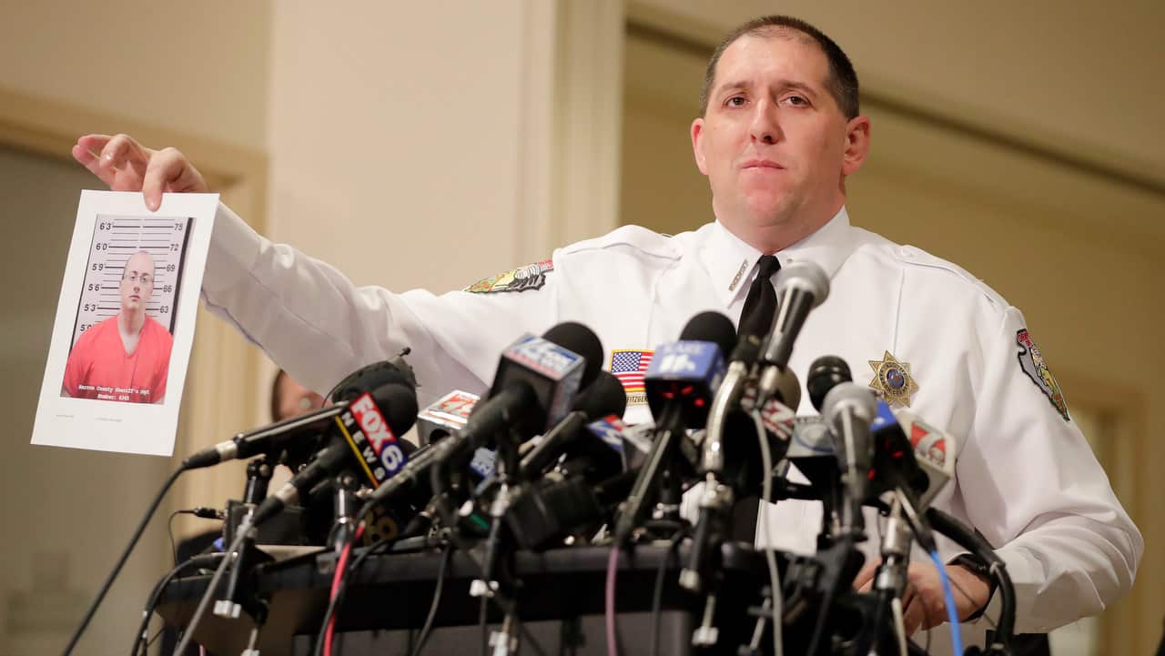 Barron County Sheriff Chris Fitzgerald holds up a photo of the suspect in custody for allegedly kidnapping Jayme Closs.