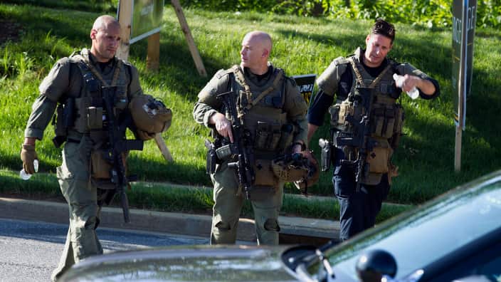 Maryland police officers patrol the site of the shooting.