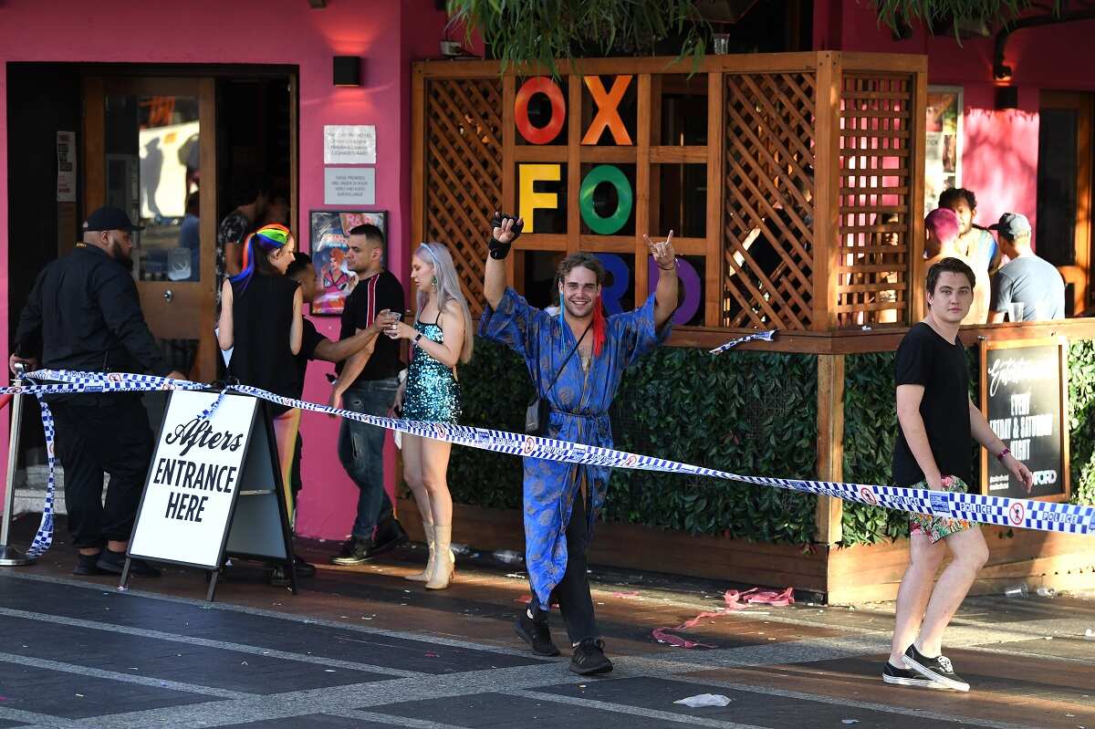 Early morning revelers seen on Oxford Street following the 42nd annual Gay and Lesbian Mardi Gras parade in Sydney, Sunday, March 1, 2020. (AAP Image/Joel Carrett) NO ARCHIVING