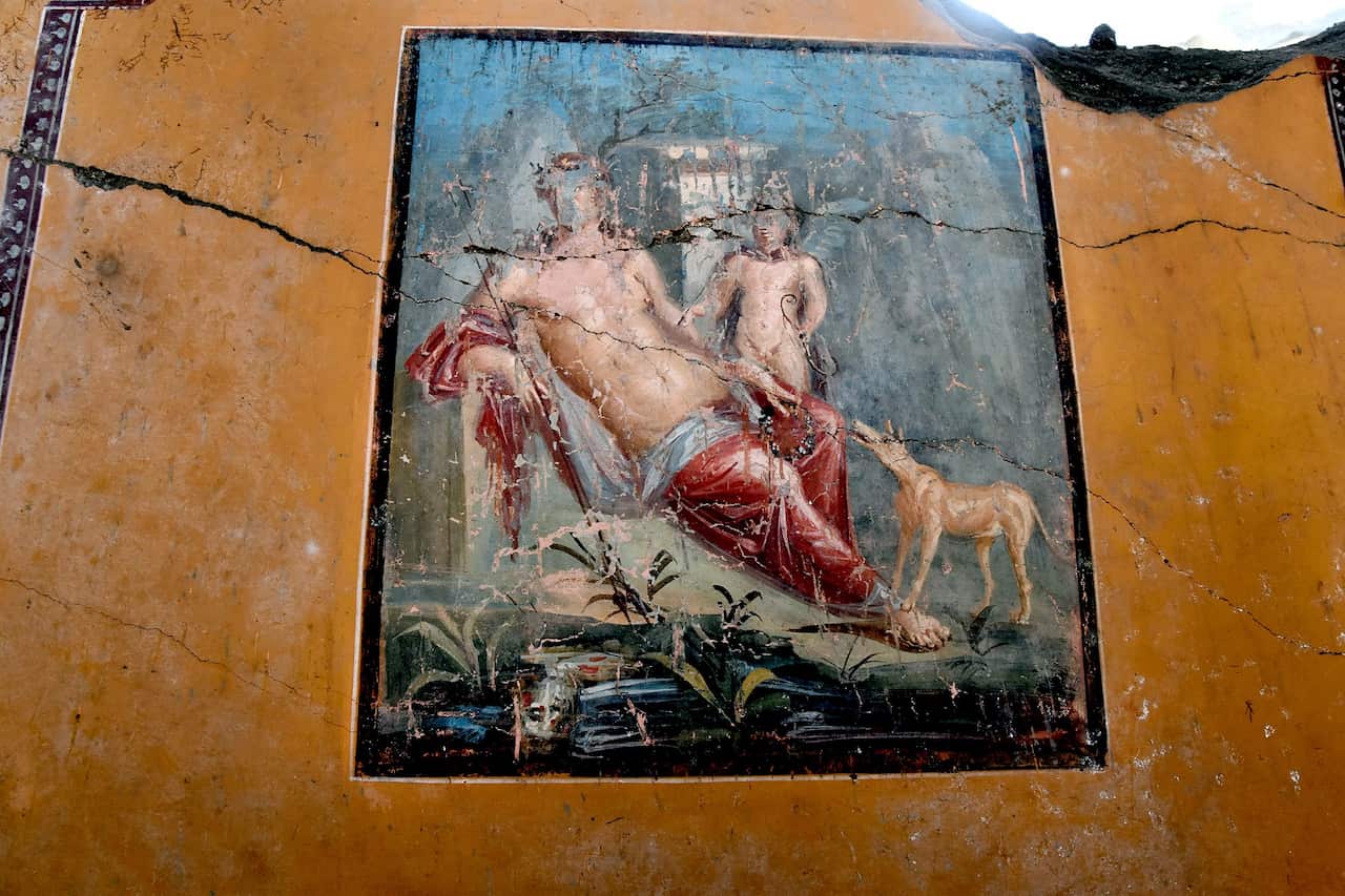 Archaeologists at Pompeii on February 14, 2019 present a fresco depicting Narcissus looking at himself in the water, falling in love with his own reflection.