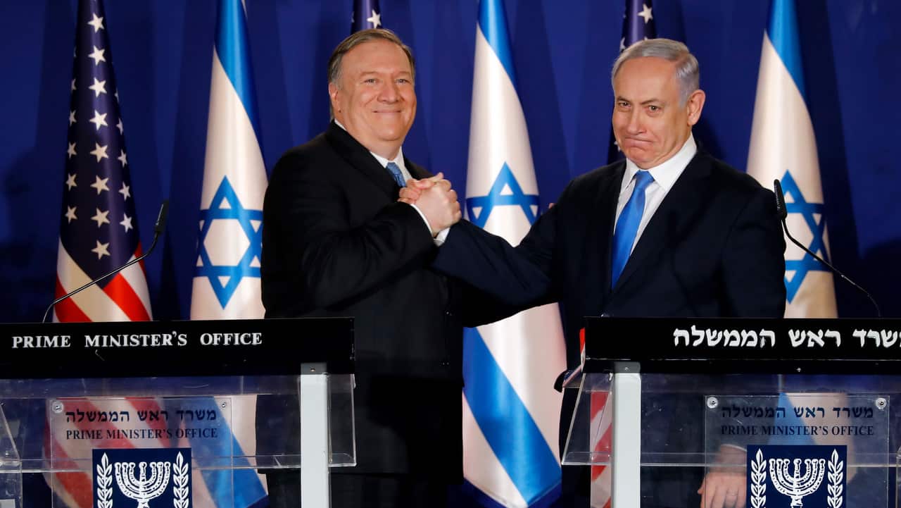 US Secretary of State Mike Pompeo shakes hands with Israeli PM Benjamin Netanyahu at Netanyahu's official residence in Jerusalem.