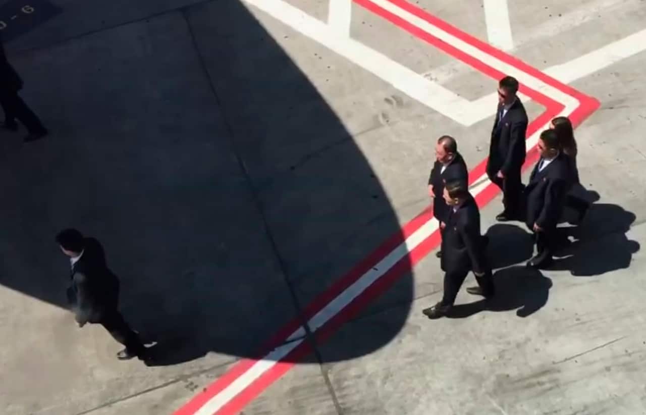 In this image made from video, Kim Yong Chol, center top, a senior North Korean official, walks across the tarmac
