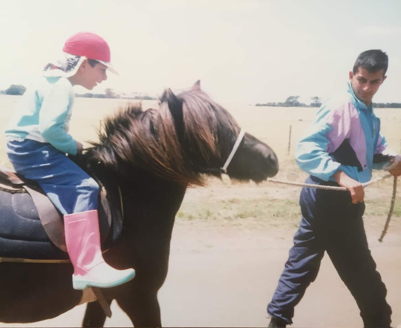 Saab Hasan leading the horse his brother rides