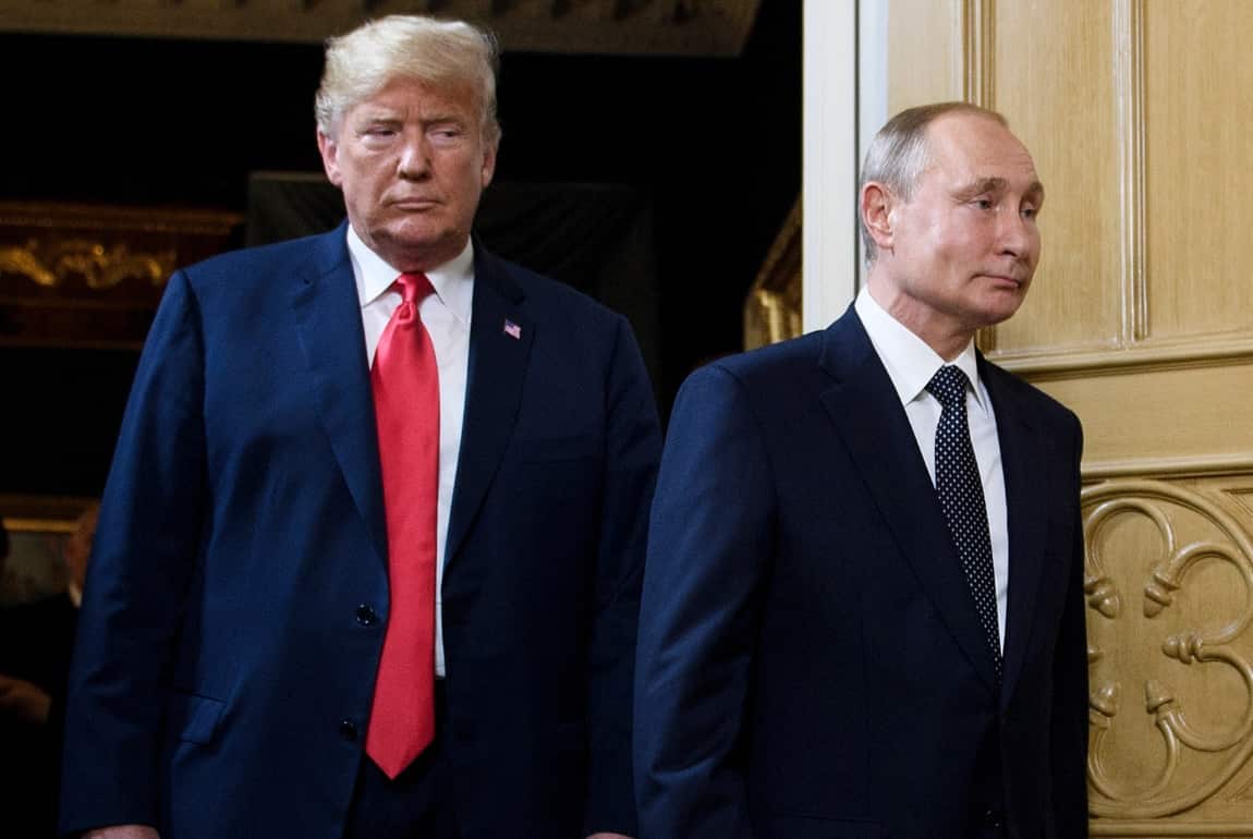 US President Donald Trump (L) and Russian President Vladimir Putin arrive for a meeting in Helsinki, on July 16, 2018. 