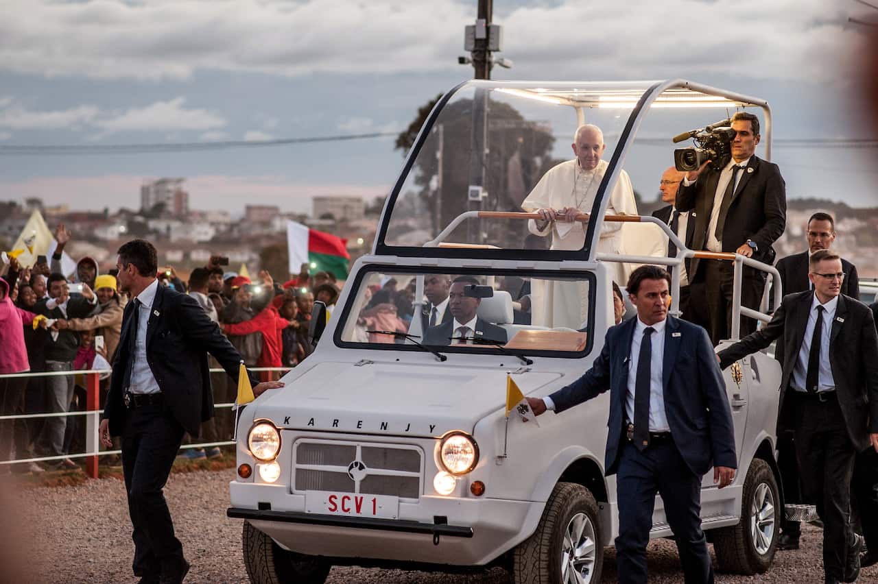 The pope looks out over the faithful. He's called on the nation to protect its forests. 