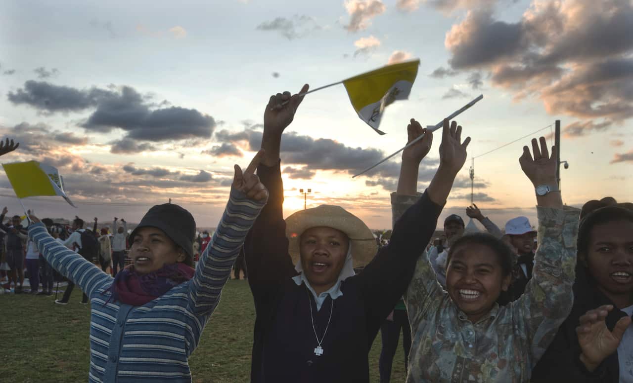 Worshippers wait for the arrival of Pope Francis at the Soamandrakizay esplanade for a vigil.
