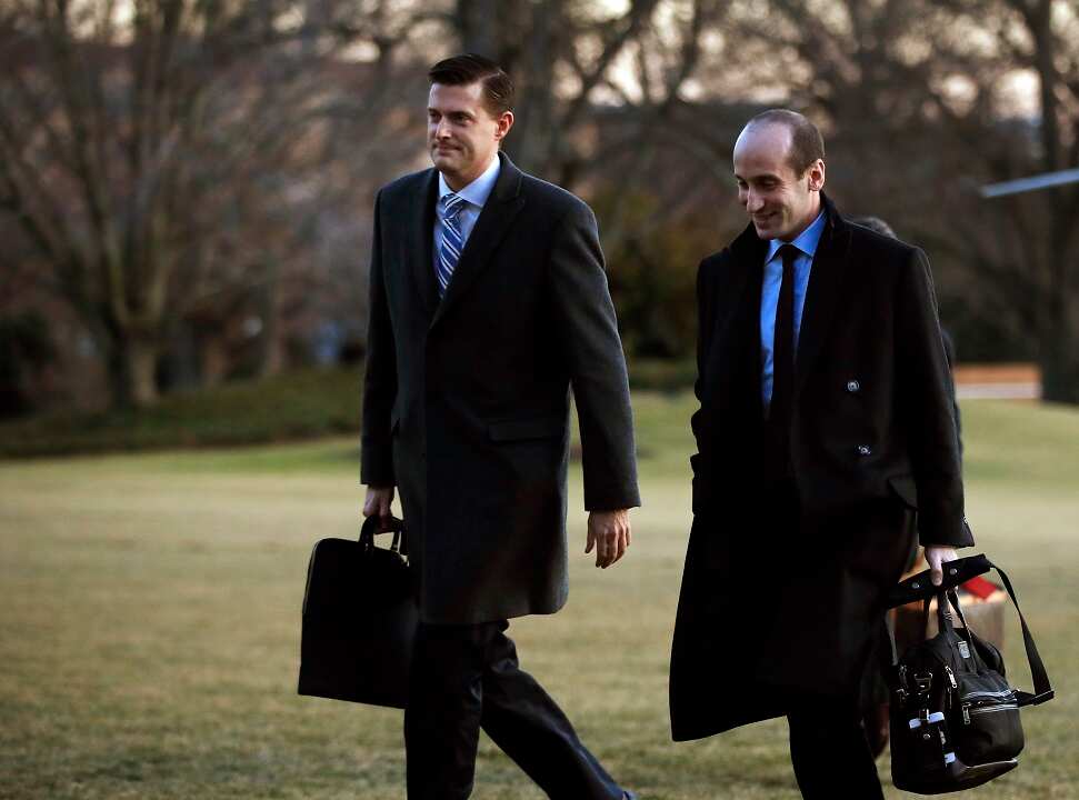 The US President has praised White House staff secretary Rob Porter, left.