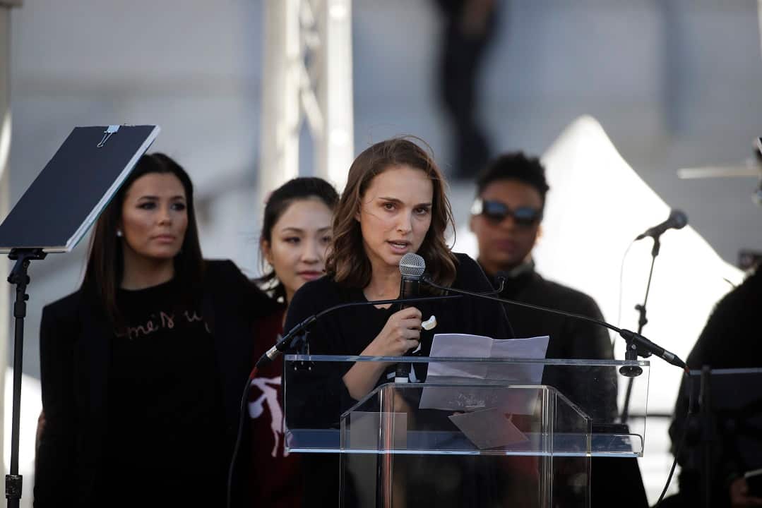 Actress Natalie Portman, right, with Eva Longoria, background left, and Constance Wu.