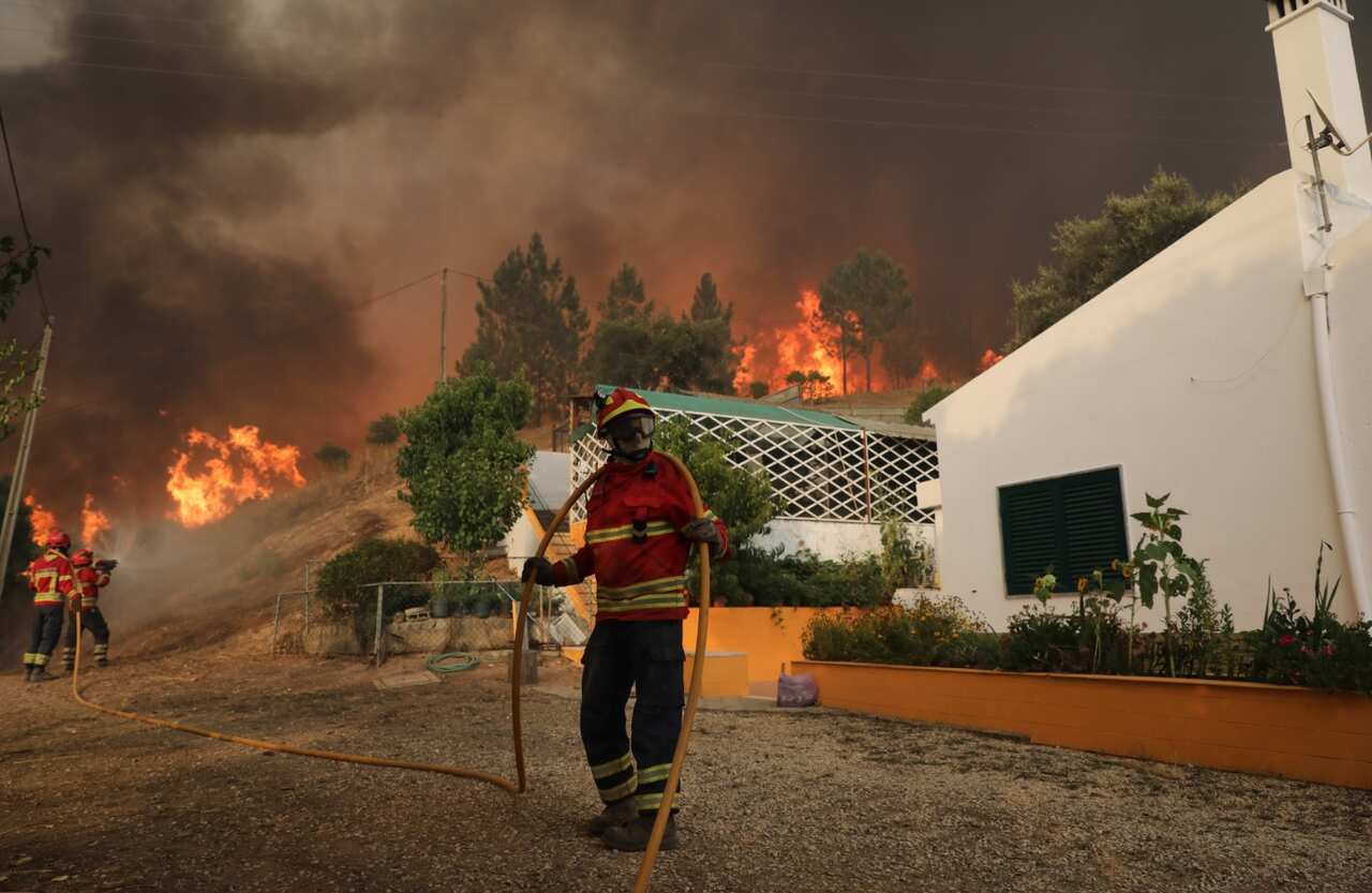 Portuguese firefighters in action on the forest fire that is ravaging in Monchique, in the Pocilgais area of Caldas de Monchique, Portugal, 06 August 2018.