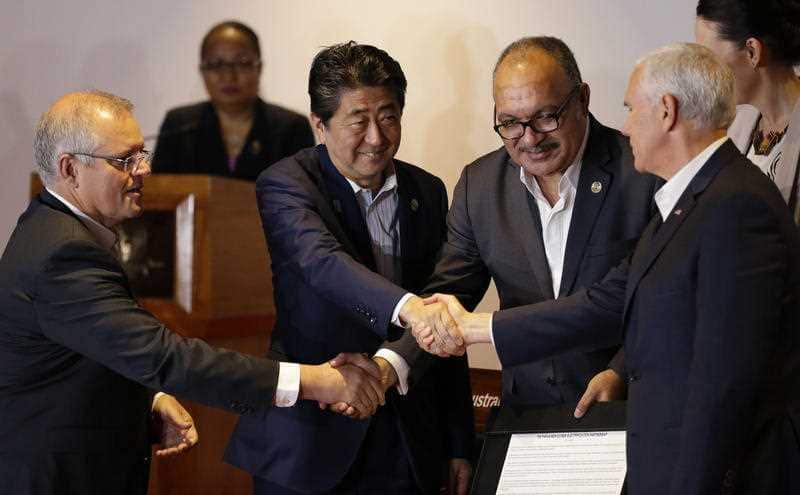 Prime Minister Scott Morrison, Japan Prime Minister Shinzo Abe, Papua New Guinea Prime Minister Peter O'Neill and US Vice President Mike Pence shake hands.