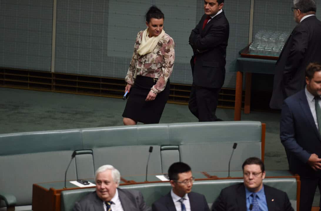 If looks could kill: Jacqui Lambie passes her party colleagues (AAP)