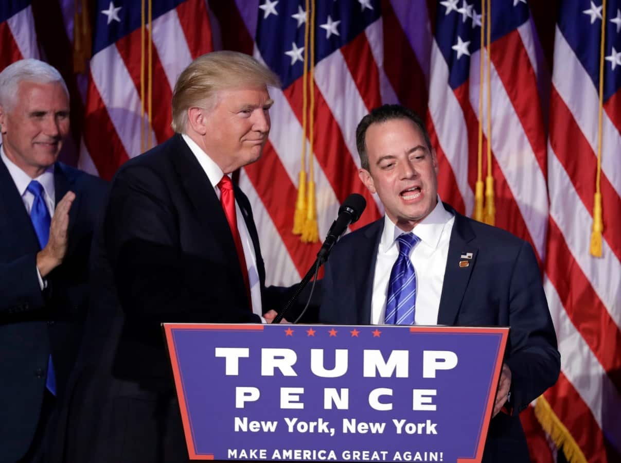 Reince Priebus, Chair of the Republican National Committee, right, speaks as President-elect Donald Trump stands nearby on election day (AAP)
