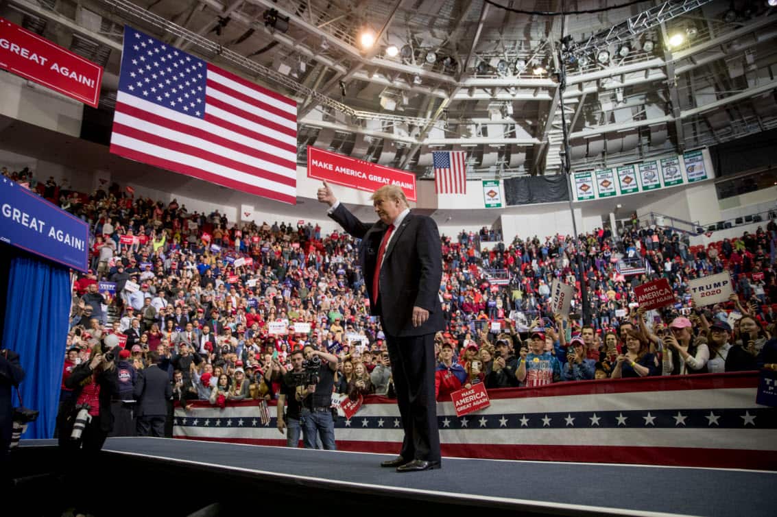 President Donald Trump waves after speaking at a rally at Resch Center Complex in Green Bay, Wis., Saturday, April 27, 2019 (AAP)
