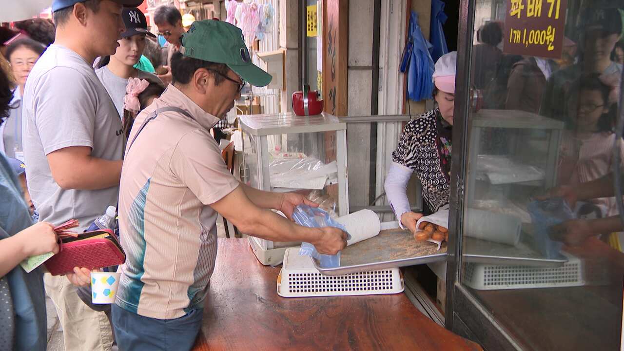 Gyodong Island's bustling marketplace ahead of the Singapore summit.