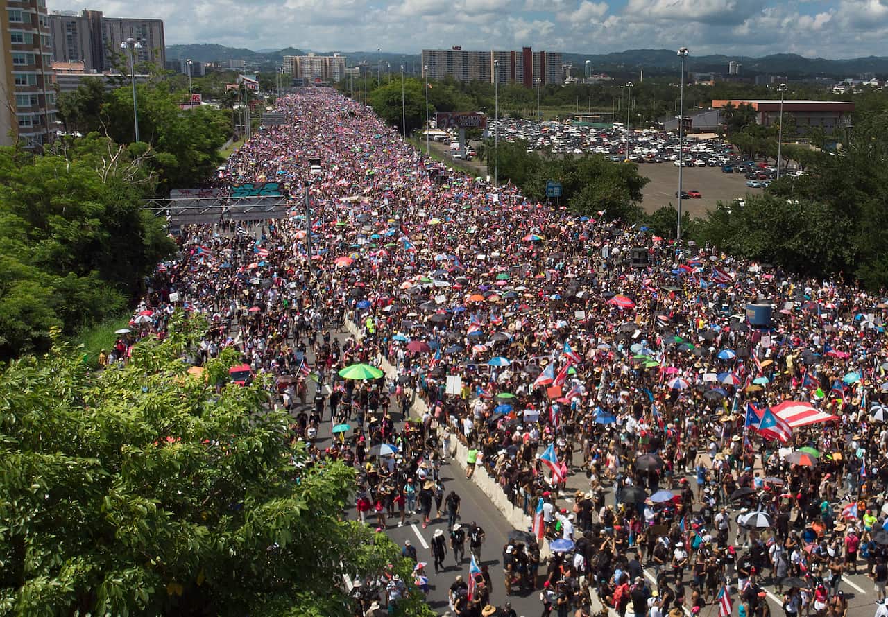 An aerial view shows thousands of people as they fill the Expreso Las Amricas highway.